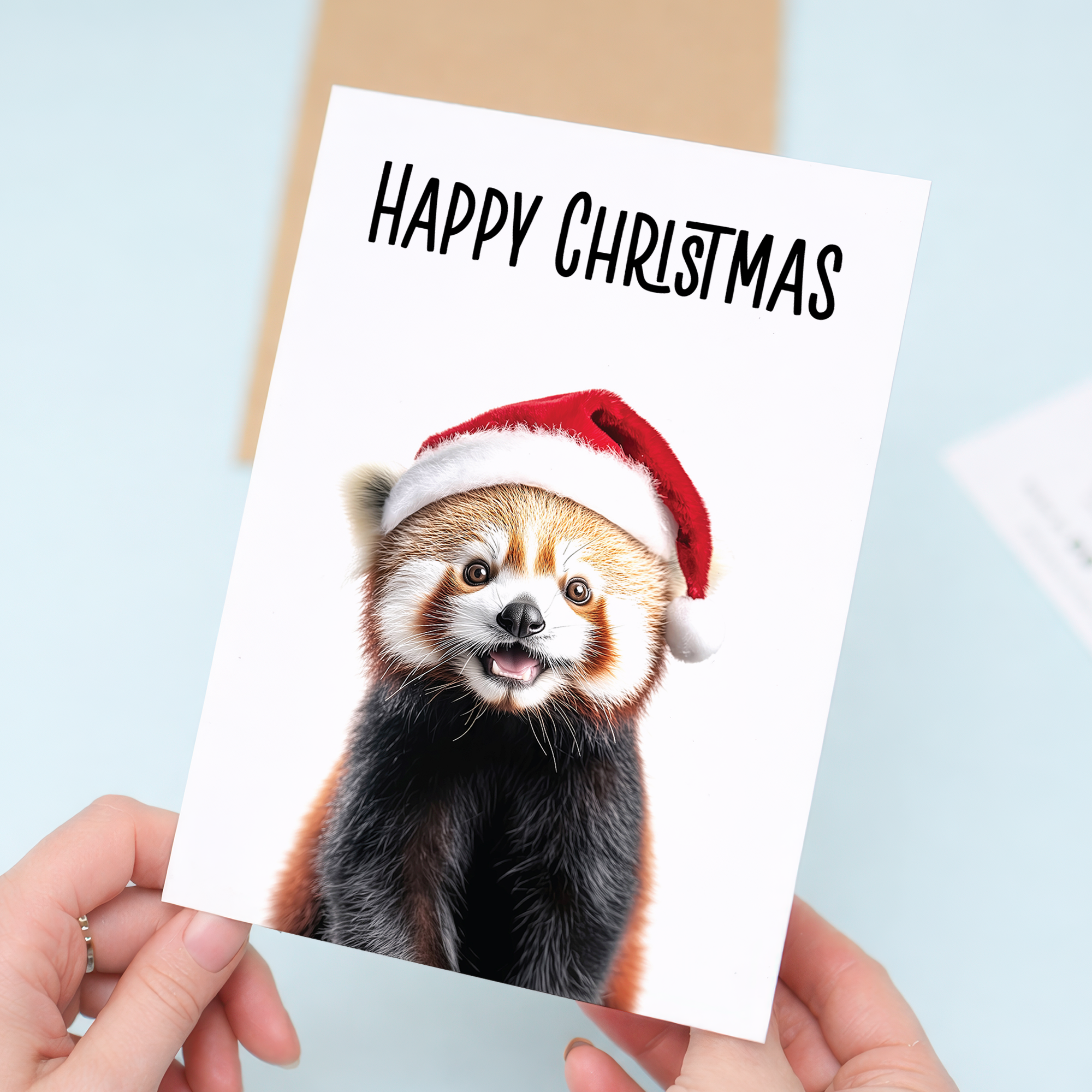 Whimsical Red Panda Christmas Card Wearing a Santa Hat, Eco-Friendly Material, For Him or Her