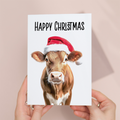Whimsical Christmas Card Featuring a Cow Wearing a Santa Hat, Eco-Friendly Material, For Him or Her
