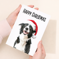 Whimsical Christmas Card featuring a Collie Dog Wearing a Santa Hat, Eco-Friendly Material, For Him or Her