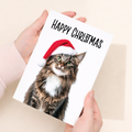 Whimsical Maine Coon Cat Wearing a Santa Hat Christmas Card, Eco-Friendly Material, For Him or Her