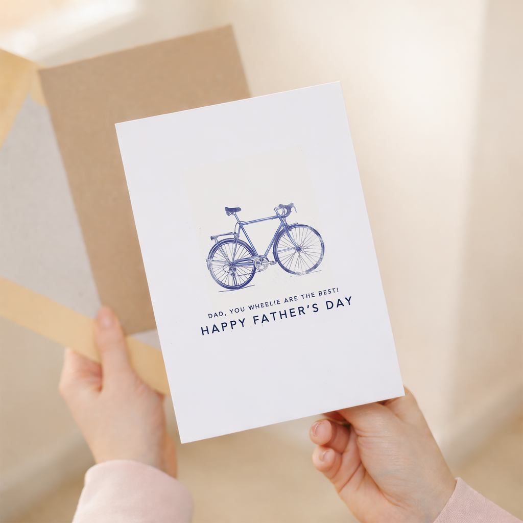 Father's Day greeting card with a minimalist blue bicycle illustration and the pun You wheelie are the best dad.