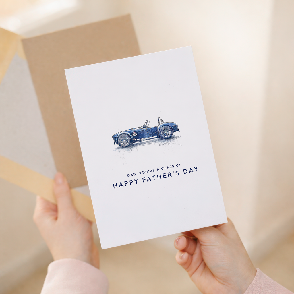 Minimalist Father's Day greeting card featuring a blue and white classic car illustration and the message You're a classic dad.