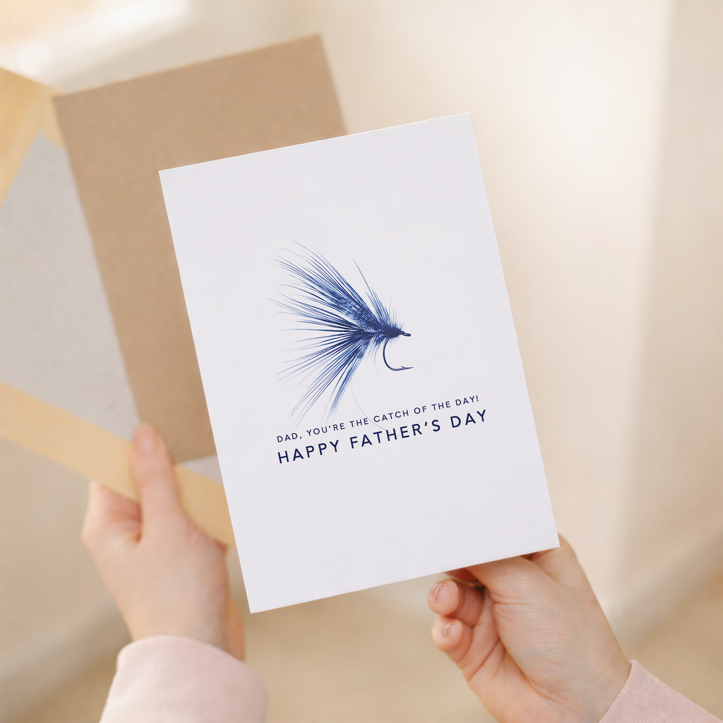 Simple Father's Day greeting card for a fisherman featuring a modern blue and white design with the text You're the Catch of the Day.