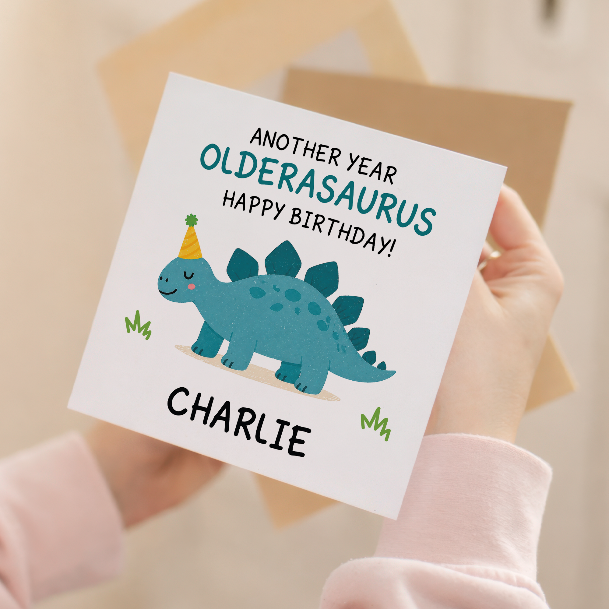 Close up product image of personalised oldersaurus dinosaur birthday card