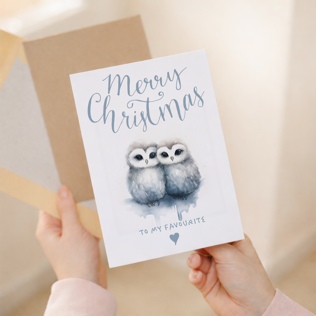 A charming Christmas card featuring two cute owls snuggling together, suitable for a partner, spouse, or loved one.