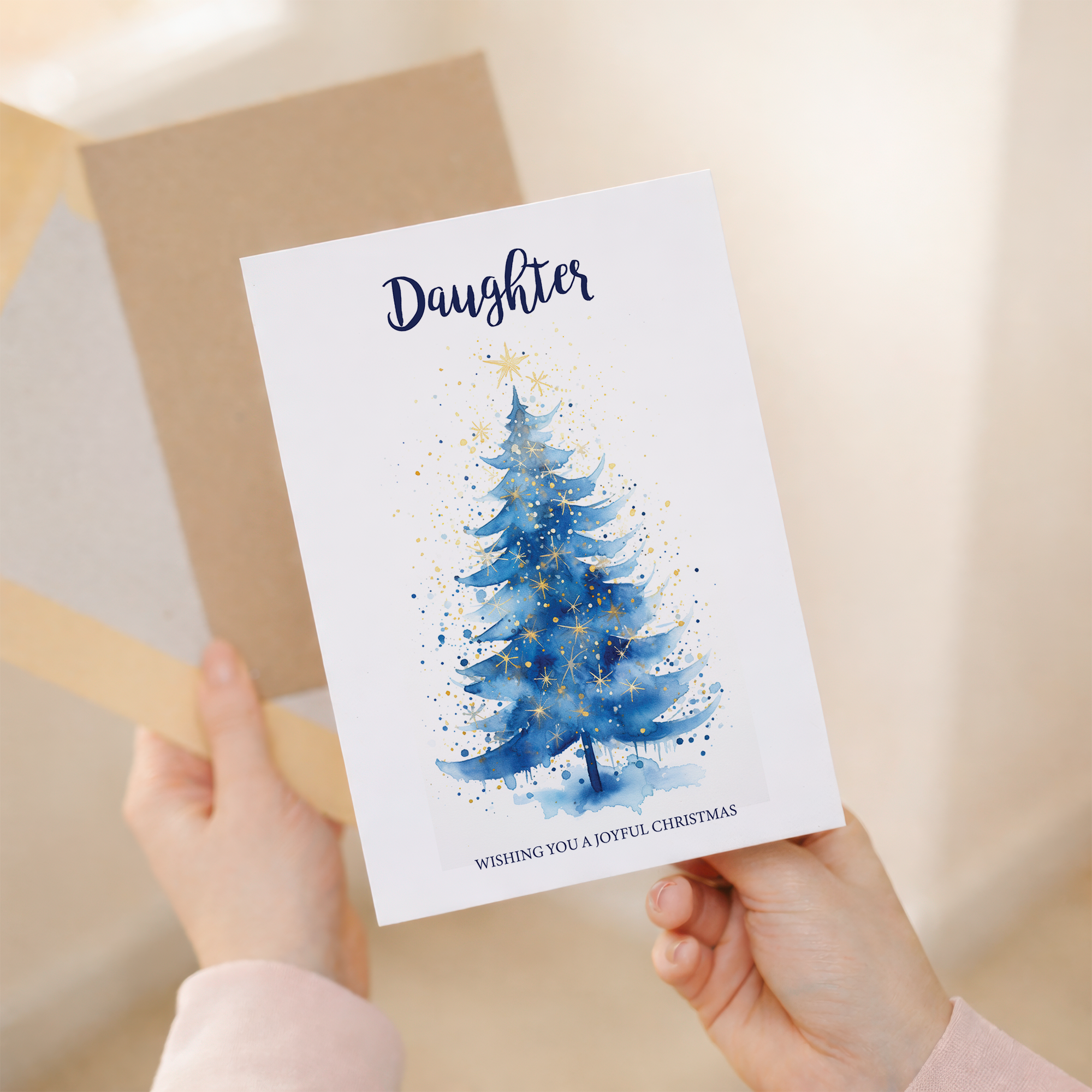 Christmas card for daughter featuring a festive Christmas tree design and a pink background.