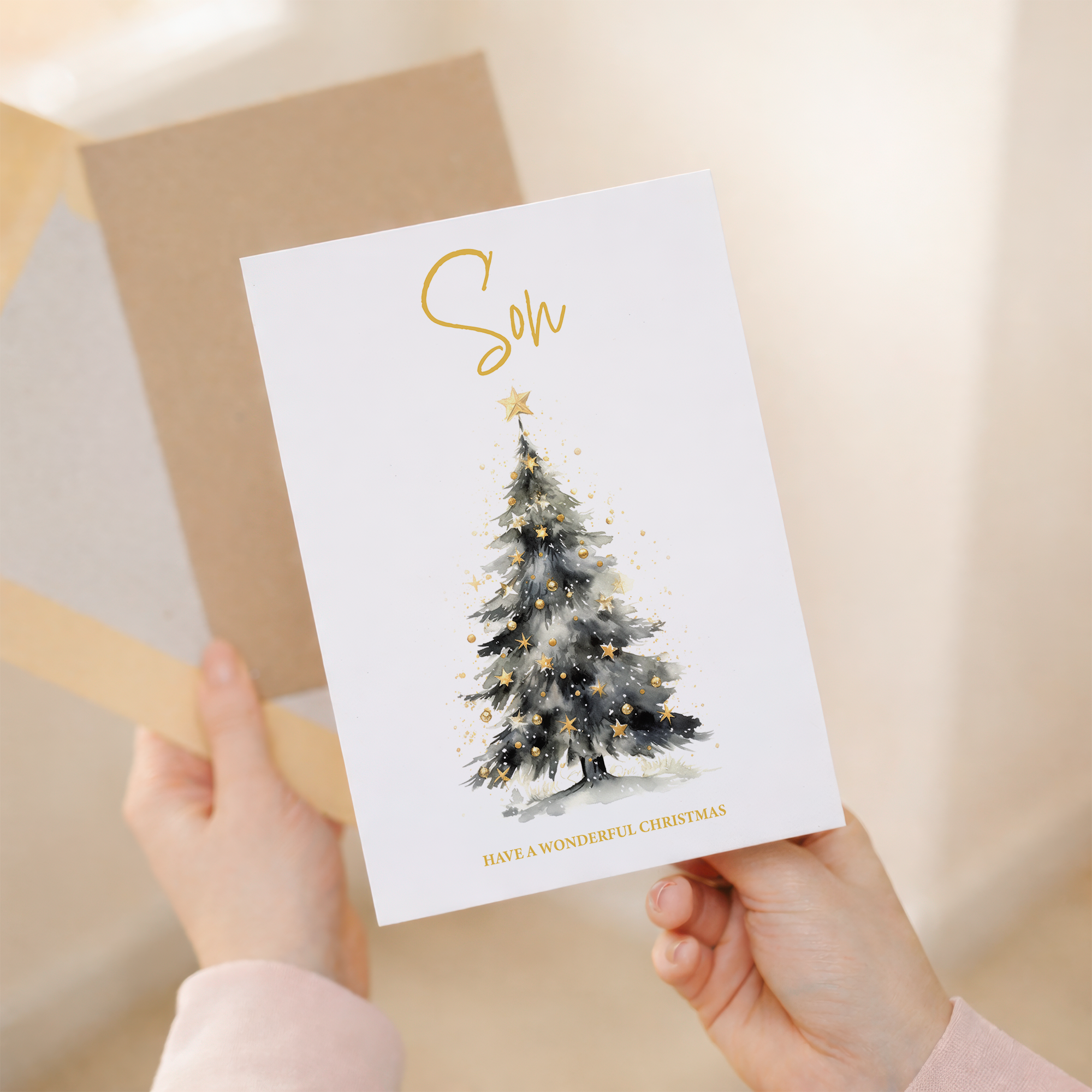 A festive Christmas card for a son featuring an illustrated Christmas tree with colorful decorations and a star on top.