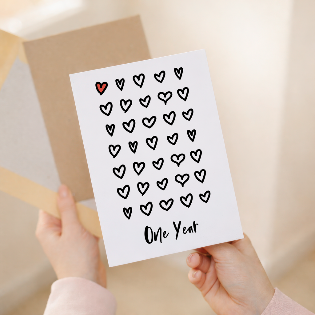 Elegant 1st Wedding Anniversary greeting card with a romantic design on sustainable recycled cardstock, accompanied by a brown Kraft envelope.