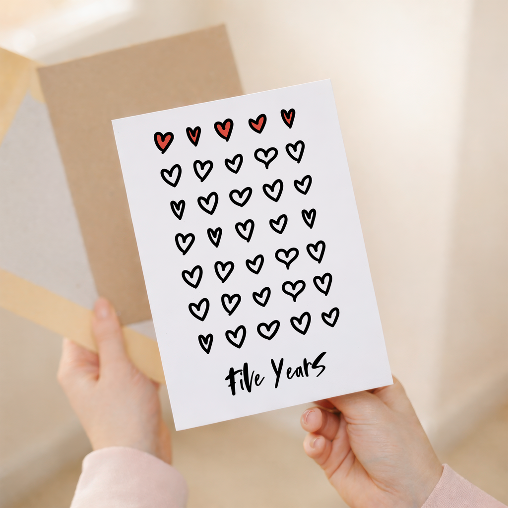 Elegant 5th wedding anniversary greeting card featuring a minimalist design on sustainable recycled cardstock, accompanied by a rustic brown Kraft envelope.