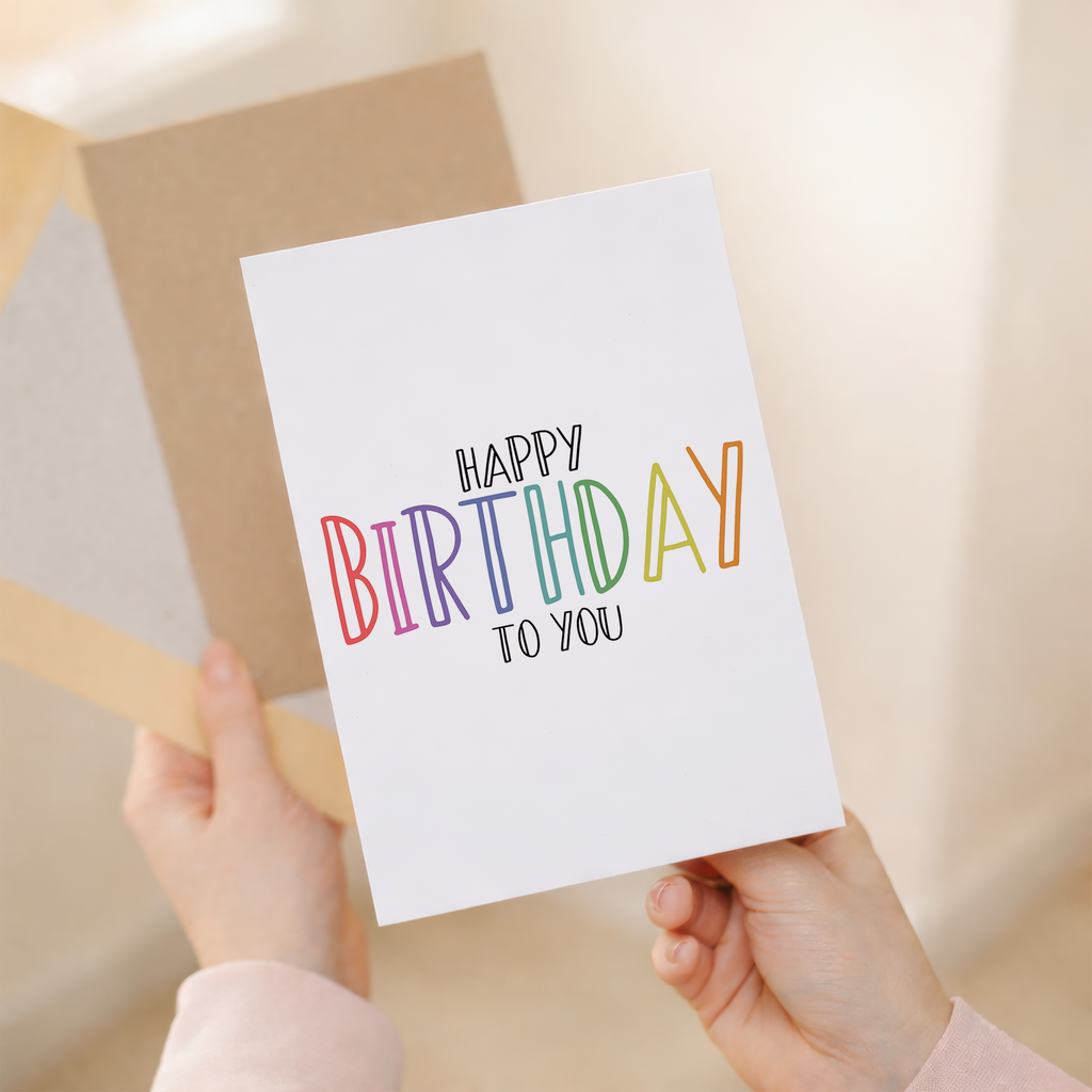 Charming 5x7 inch birthday greeting card printed on sustainable recycled cardstock, featuring a festive Happy Birthday design and paired with a brown Kraft envelope.