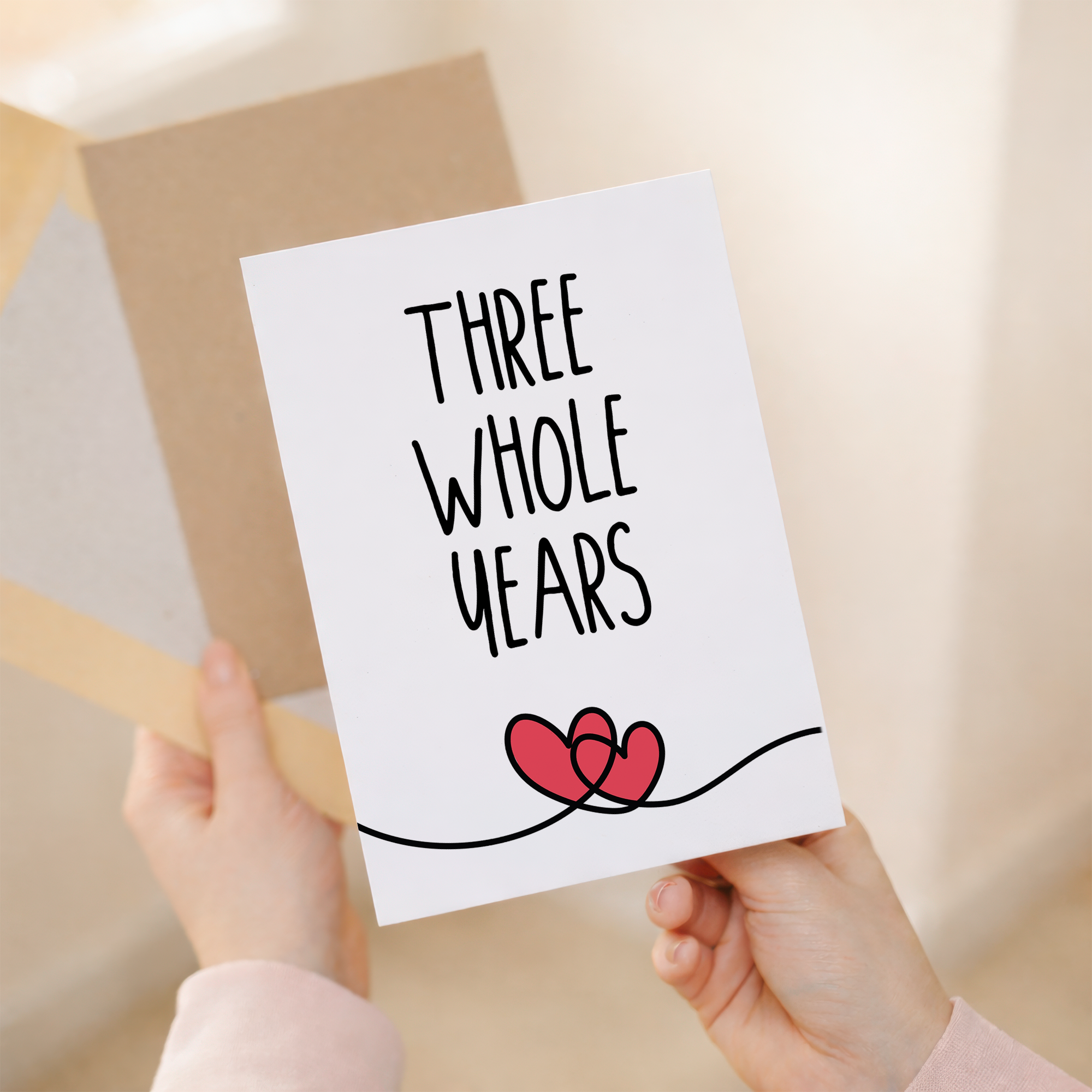 3rd anniversary greeting card featuring a simple, elegant design on recycled cardstock, paired with a rustic brown Kraft envelope.