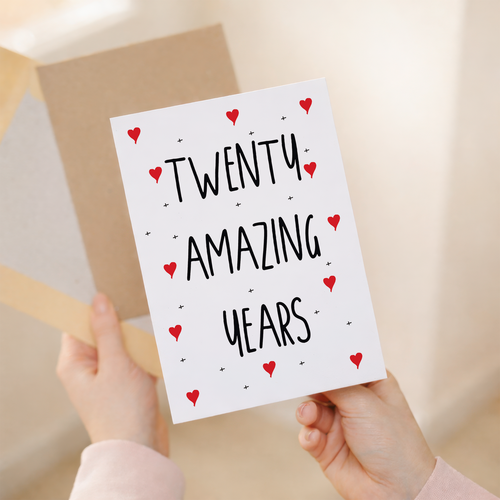 Elegant 20th Anniversary greeting card featuring a clean, minimalist design with a recycled brown kraft envelope on a sustainable cardstock background.