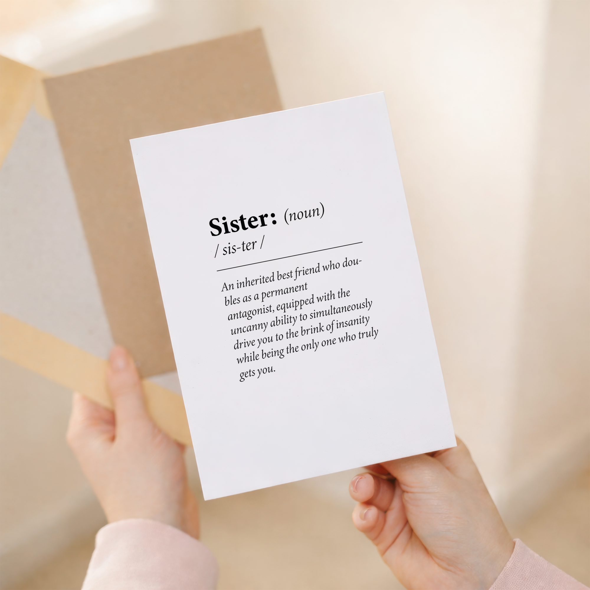 Funny dictionary-style birthday card for a sister featuring a witty quote on sustainable recycled cardstock, paired with a brown Kraft envelope.