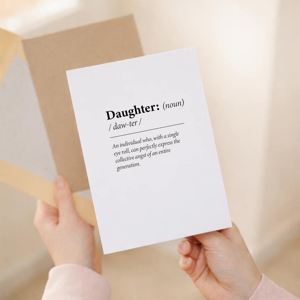 Fun dictionary-themed birthday card for a daughter featuring a humorous definition of the word Daughter on sustainable recycled cardstock, paired with a brown Kraft envelope.