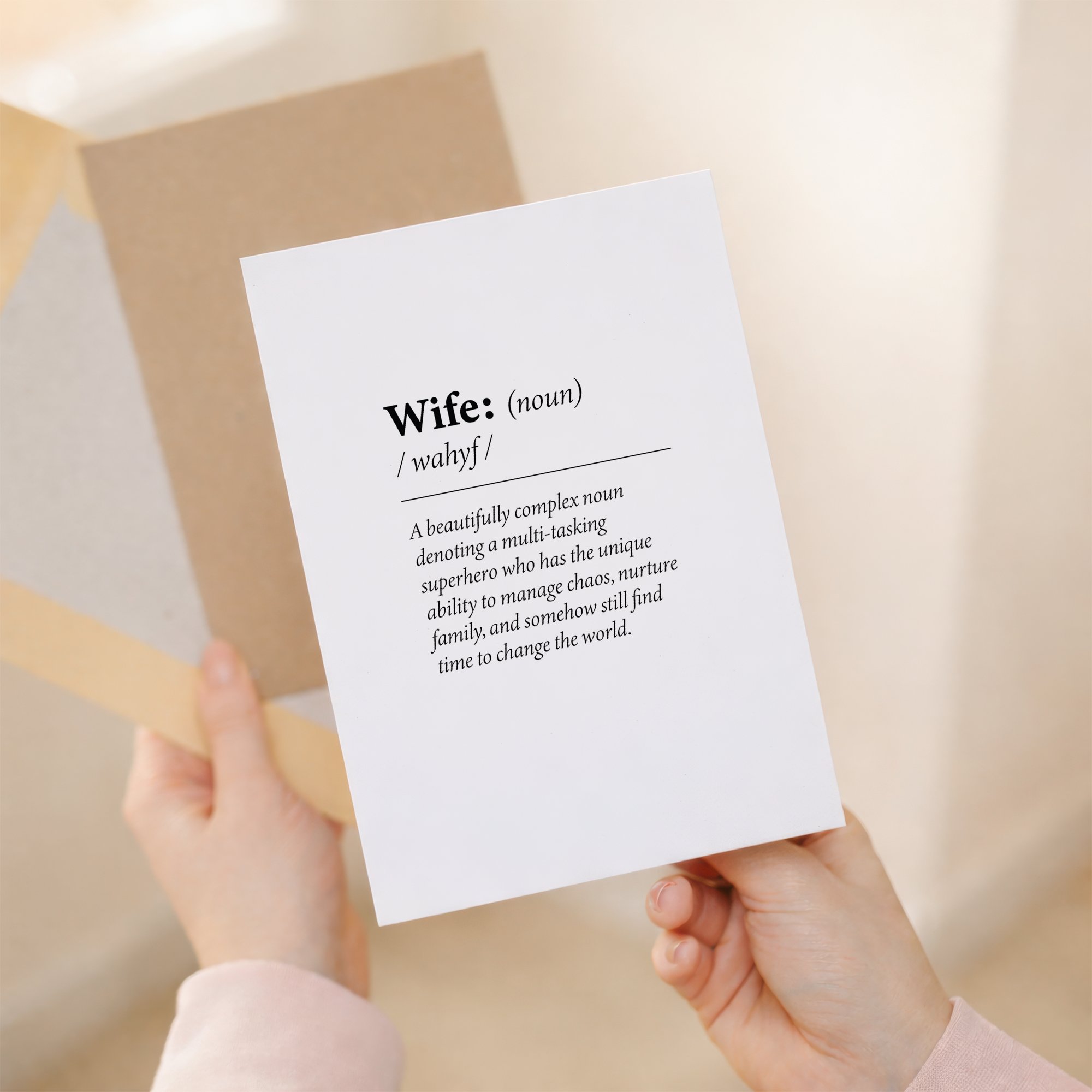 Humorous 5x7 inch birthday greeting card for a wife featuring a fun dictionary-style quote on sustainable recycled cardstock, paired with a brown Kraft envelope.