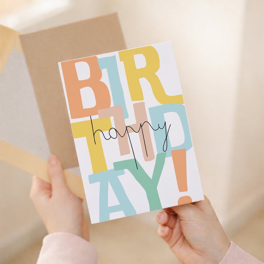 Charming birthday greeting card featuring a typographic design with letters and numbers on sustainable recycled cardstock, paired with a brown Kraft envelope.