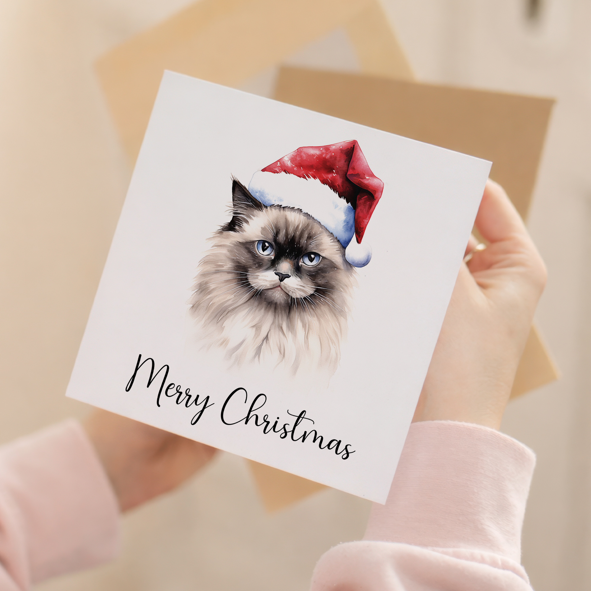 Fun Christmas Card of a Ragdoll Cat Wearing A Santa Hat Whimsical Watercolour Christmas Card For Animal Lover For Him or Her