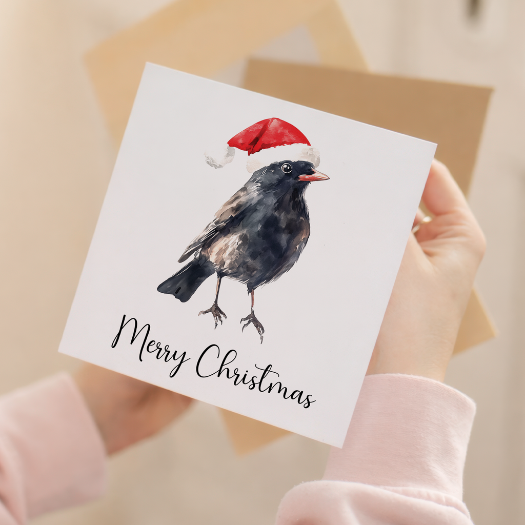 Fun Christmas Card of a Black Bird Wearing A Santa Hat Whimsical Watercolour Christmas Card For Bird Lover For Him or Her