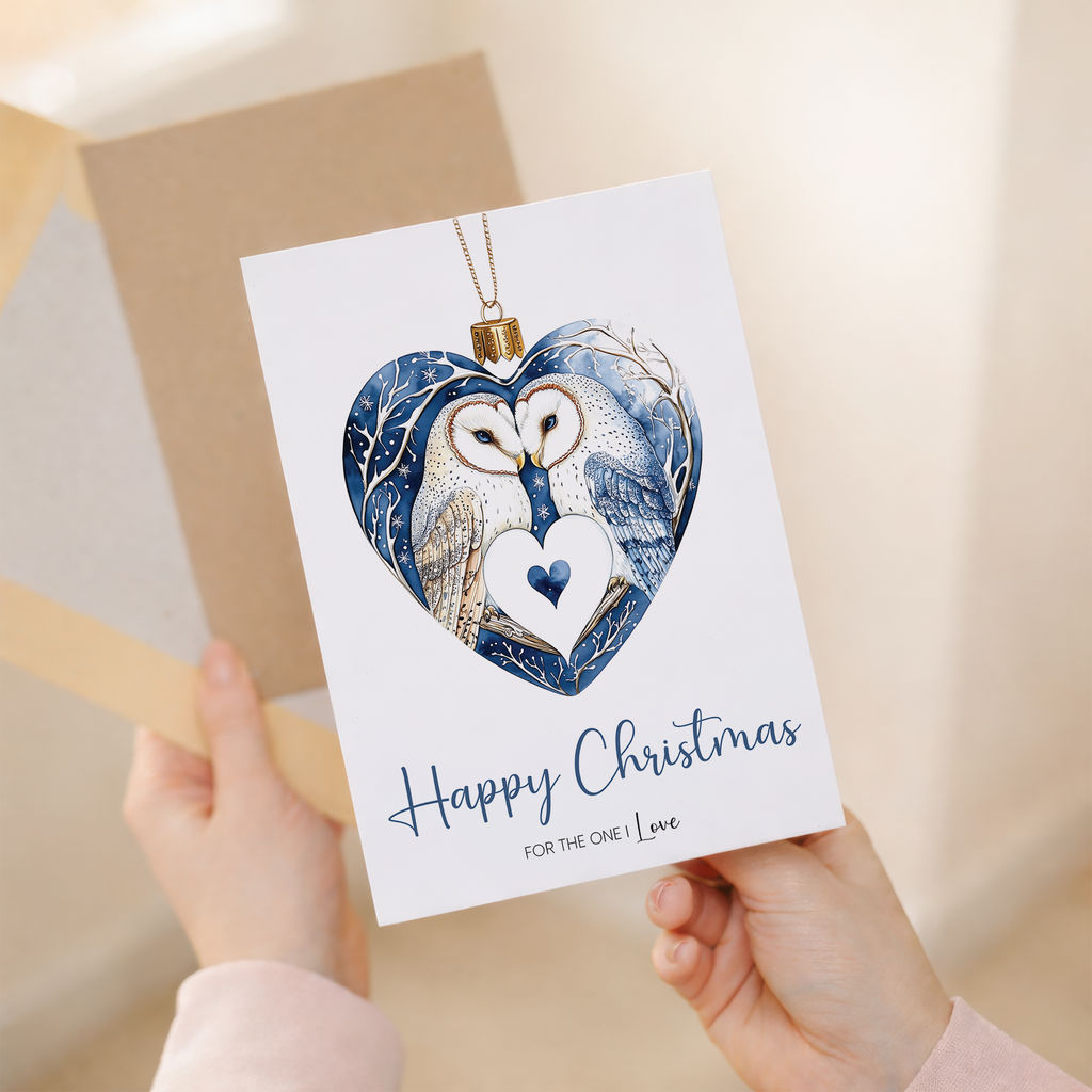 A romantic Christmas card for a partner featuring a pretty owl design inside a festive bauble.
