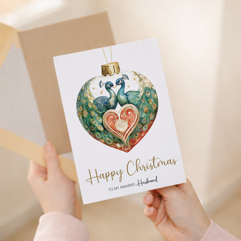 A festive Christmas greeting card for a husband featuring a decorative blue peacock-themed bauble design with elegant gold accents on a white background.