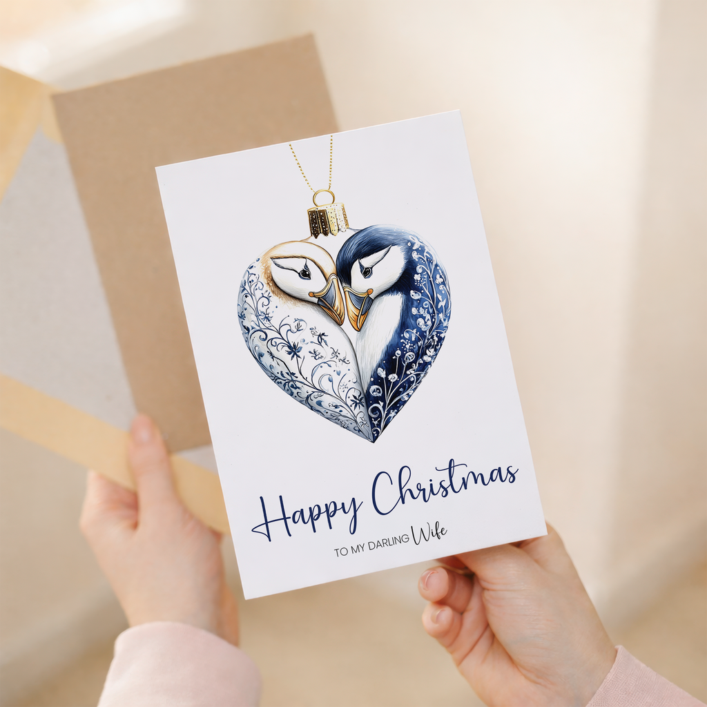 A festive Christmas card for a wife featuring a charming puffin inside a decorative holiday bauble.