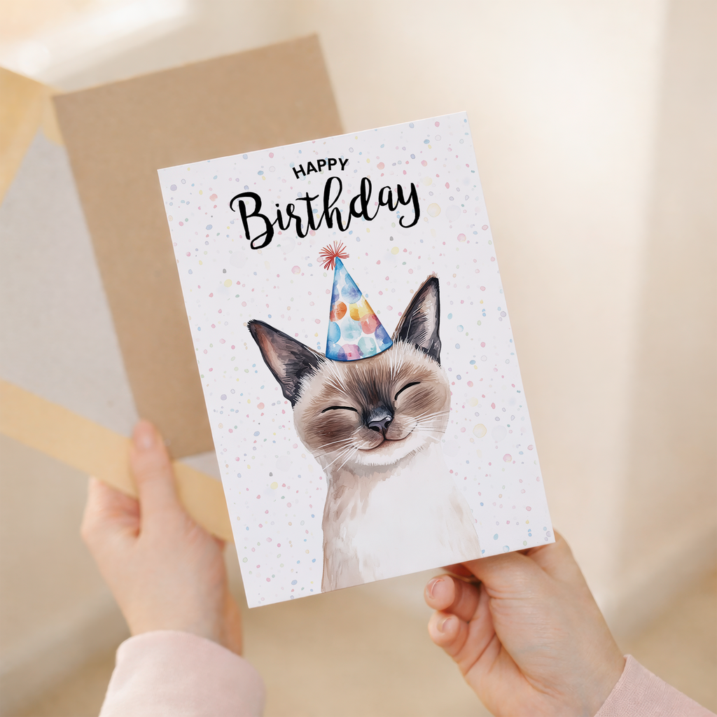 Watercolour illustration of a Siamese cat on a white birthday card with a modern, minimalist design.