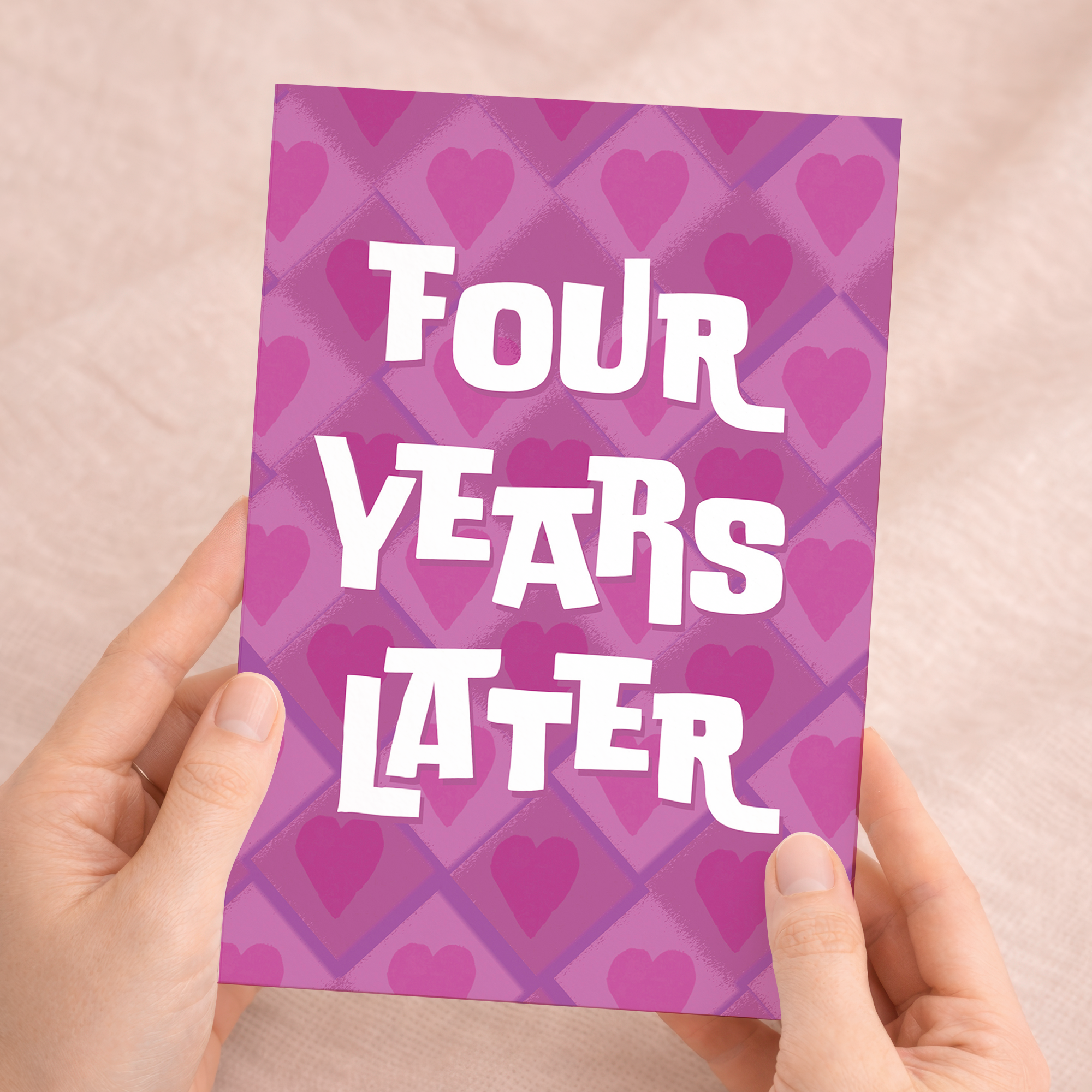 A simple and modern 5x7 inch 4th wedding anniversary greeting card featuring the number 4 and colorful floral accents in pink and purple, paired with a brown Kraft envelope.