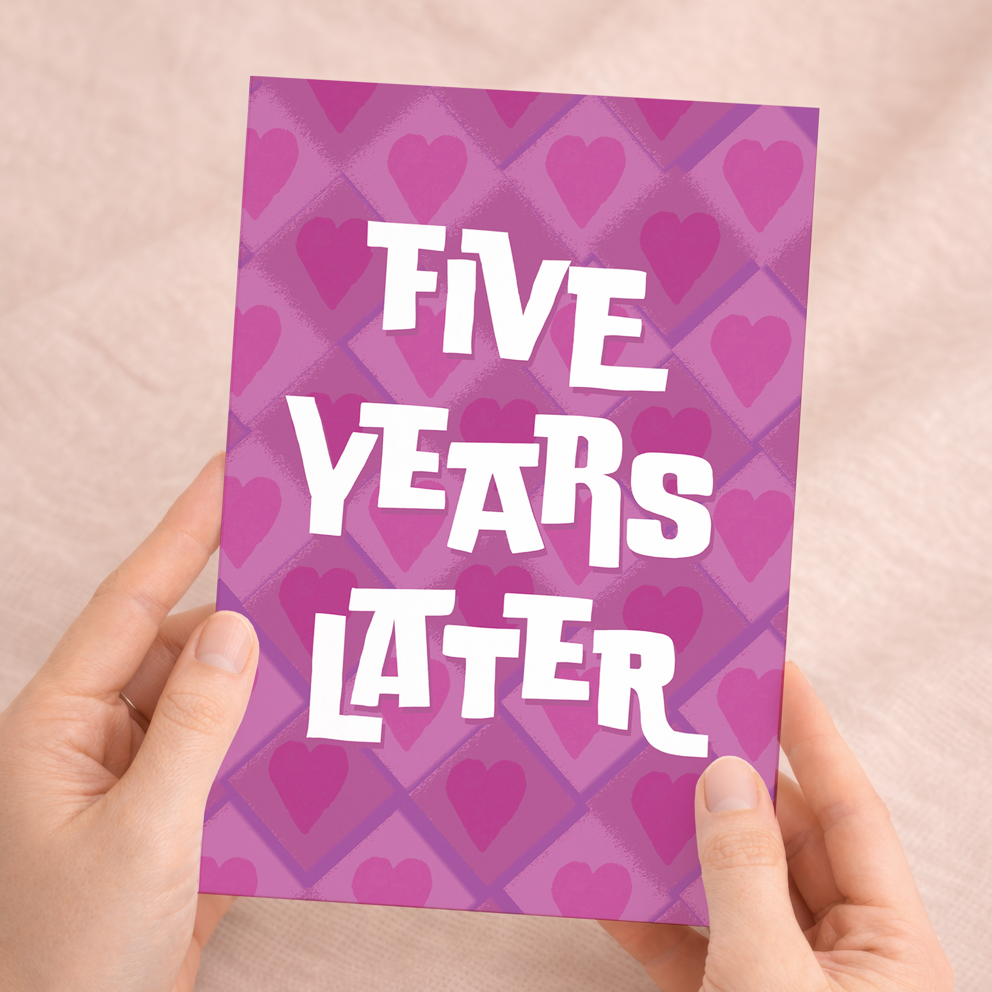 Minimalist 5th Wedding Anniversary greeting card featuring a large, stylized number five adorned with pink and purple floral patterns on eco-friendly cardstock, accompanied by a brown Kraft envelope.