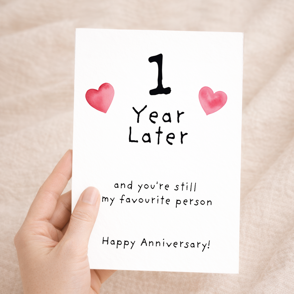 Elegant 1st Wedding Anniversary greeting card with a romantic design on sustainable recycled cardstock, accompanied by a natural brown Kraft envelope.