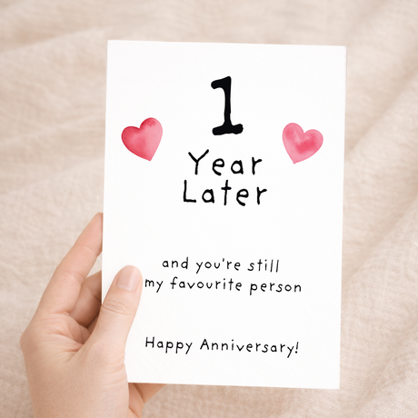 Elegant 1st Wedding Anniversary greeting card with a romantic design on sustainable recycled cardstock, accompanied by a natural brown Kraft envelope.
