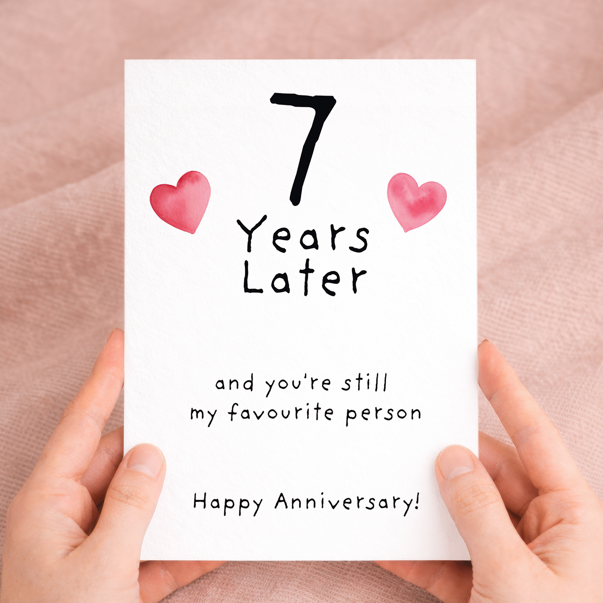 Handmade 7th wedding anniversary card featuring elegant text and floral details on recycled cardstock, paired with a rustic brown Kraft envelope.