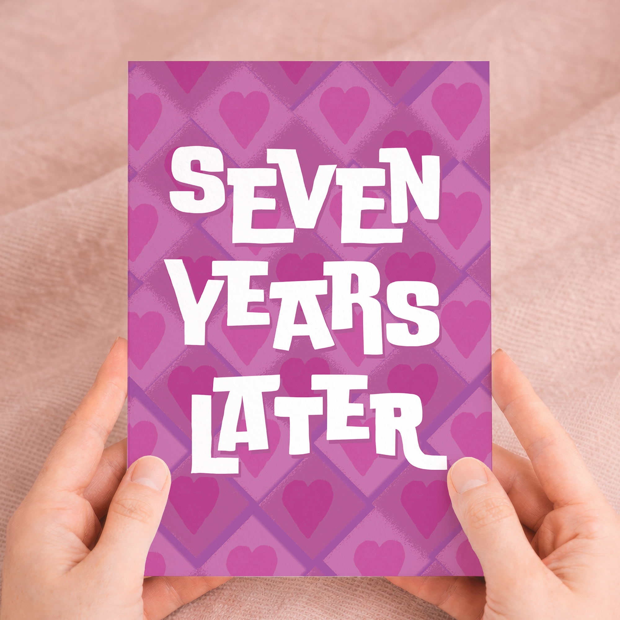Elegant 7th Wedding Anniversary greeting card featuring a modern design in pink, white, and purple on sustainable recycled cardstock, paired with a classic brown Kraft envelope.