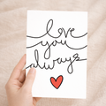 Romantic Valentine's Day greeting card featuring a charming "Love You Always" design on sustainable recycled cardstock, accompanied by a classic brown Kraft envelope.