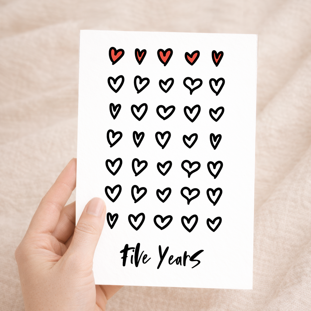 Elegant 5th wedding anniversary greeting card featuring a minimalist design on sustainable recycled cardstock, accompanied by a rustic brown Kraft envelope.