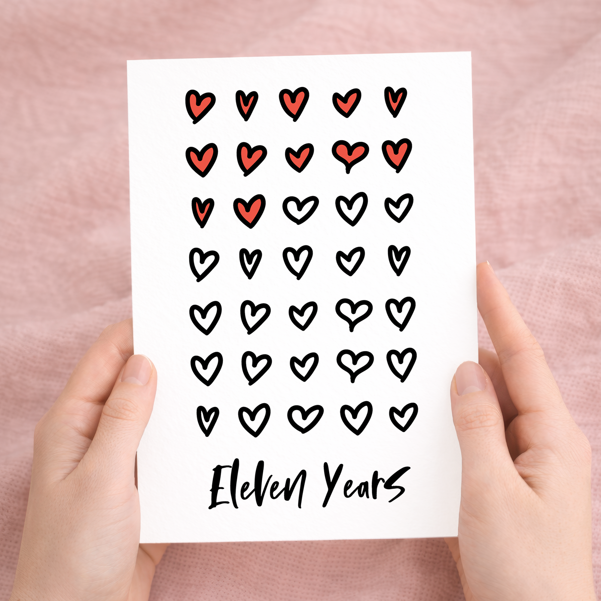 Elegant 11th wedding anniversary greeting card with a minimalist design on recycled cardstock, paired with a brown Kraft envelope.