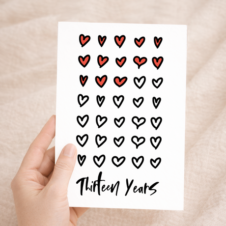 Elegant 13th wedding anniversary greeting card featuring a romantic design on eco-friendly recycled cardstock, paired with a rustic brown Kraft envelope.