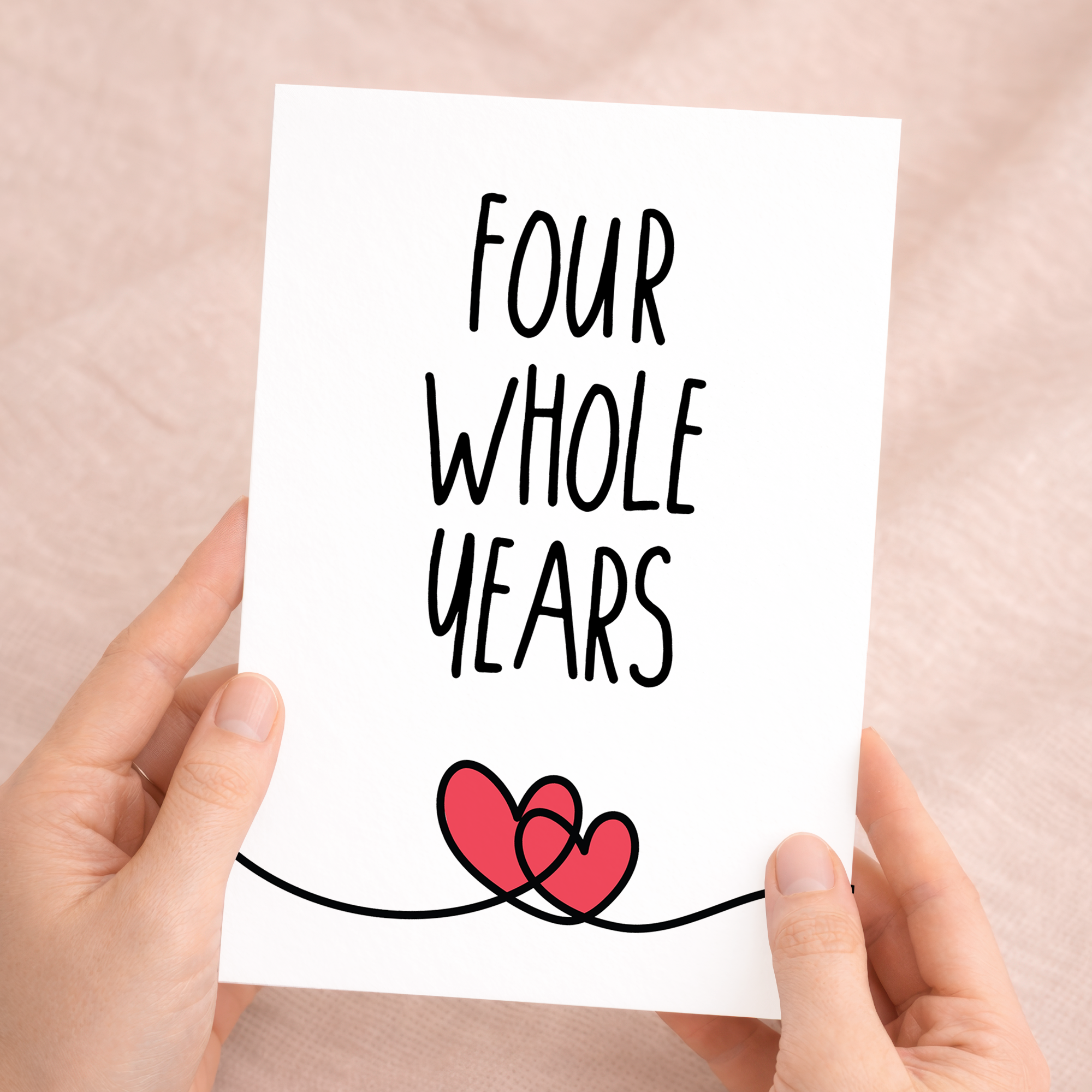 An elegant 4th anniversary greeting card featuring a minimalist design on eco-friendly, recycled cardstock, paired with a rustic brown Kraft envelope.