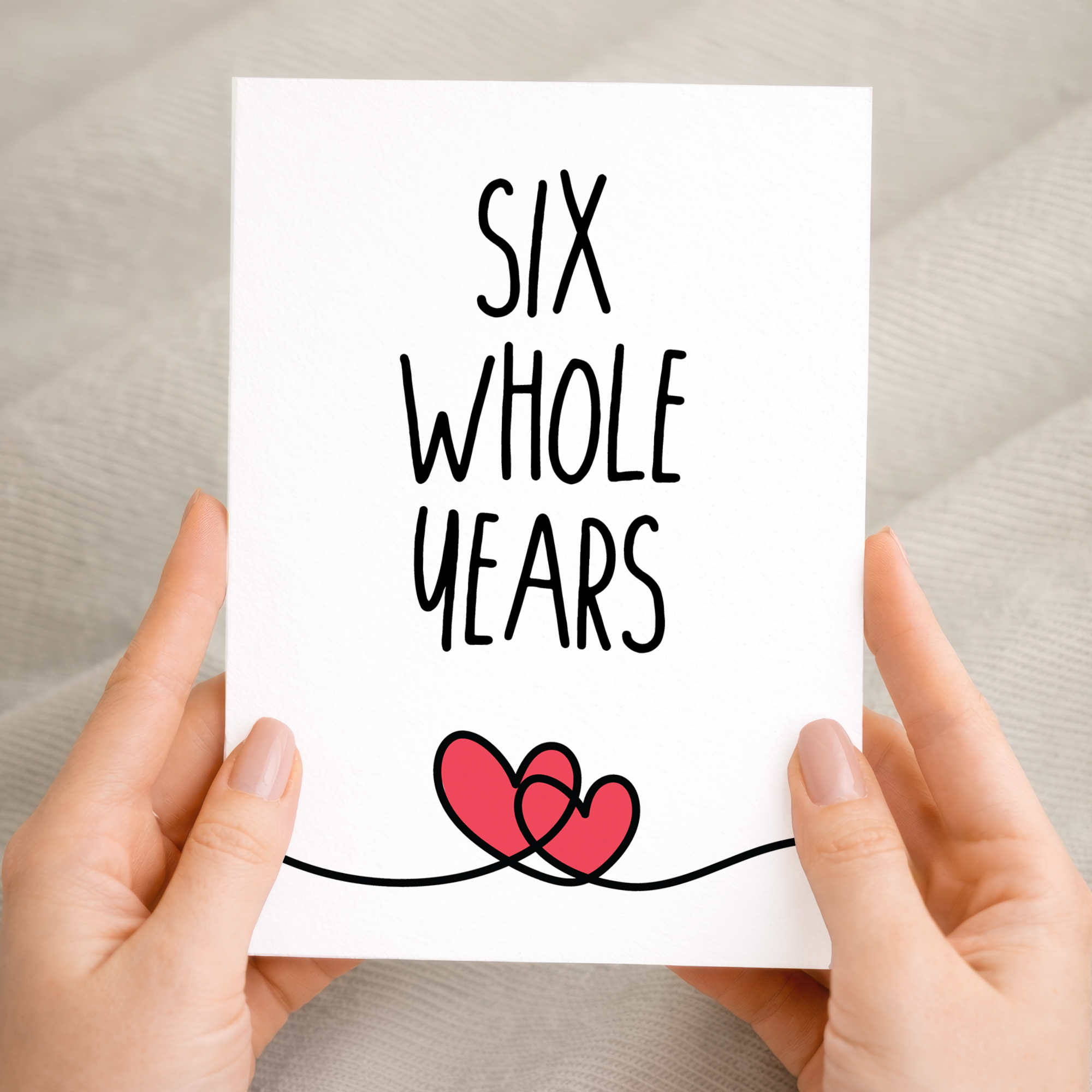 Charming 6th anniversary greeting card featuring a central heart illustration with floral patterns on eco-friendly cardstock, accompanied by a brown Kraft envelope.