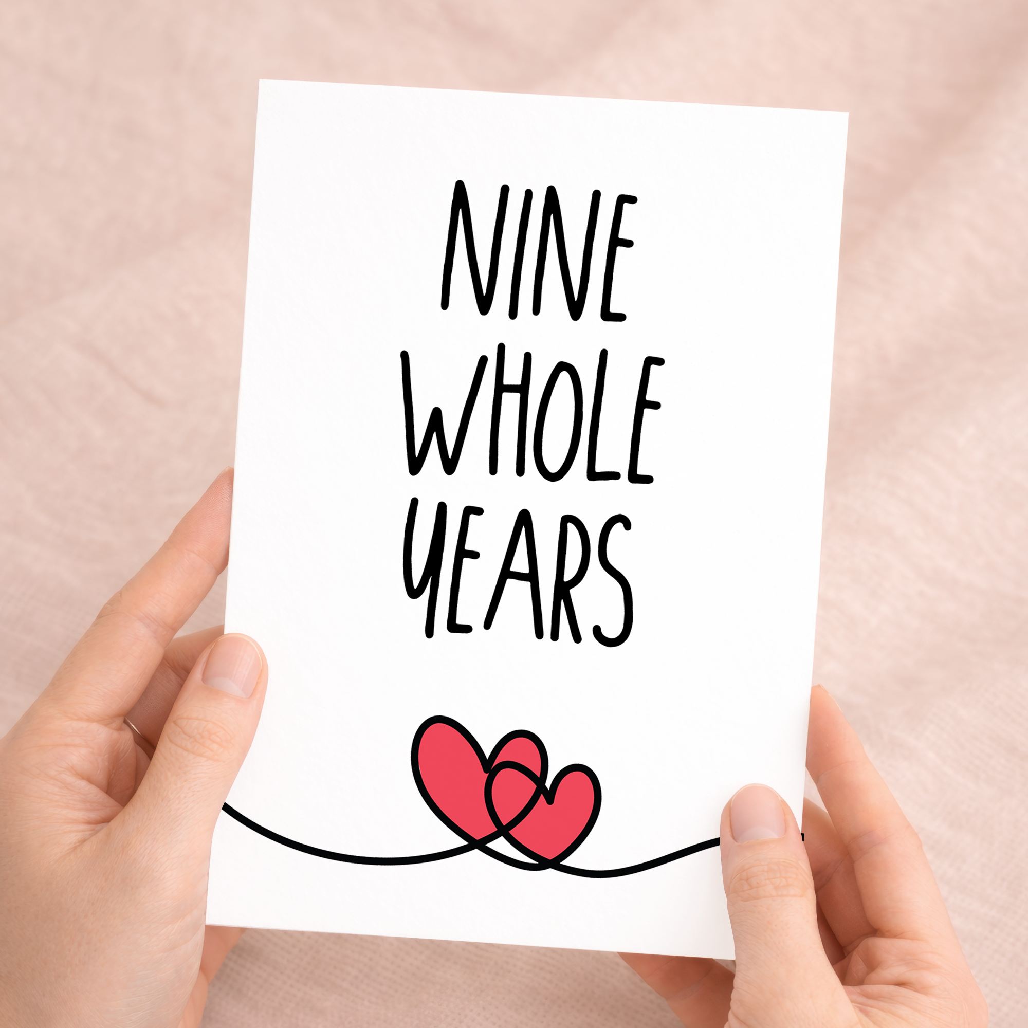 Elegant 9th anniversary greeting card featuring a minimalist design on sustainable recycled cardstock, accompanied by a rustic brown Kraft envelope.