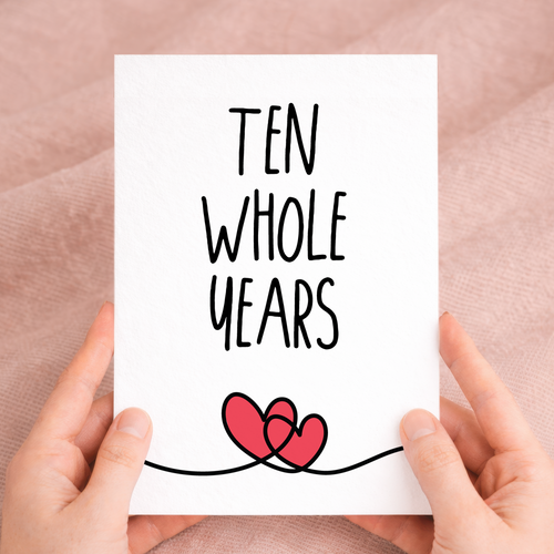 Elegant 10th anniversary greeting card featuring a "10 Years" design on sustainable recycled cardstock, paired with a brown Kraft envelope.