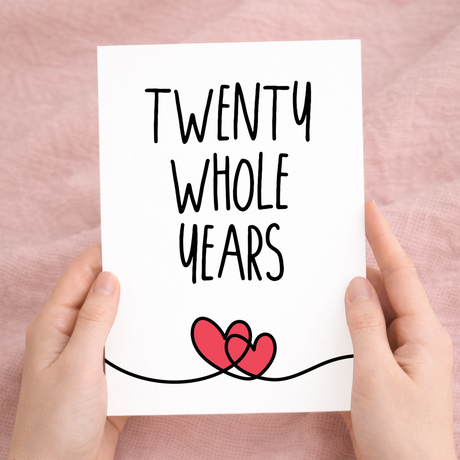 Elegant 20th anniversary greeting card featuring a central "20" design on sustainable recycled cardstock, paired with a rustic brown Kraft envelope.