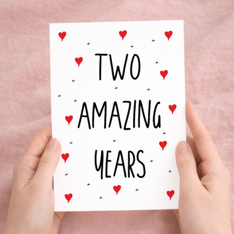 Heartfelt 2nd anniversary greeting card featuring elegant typography on sustainable recycled cardstock, paired with a brown Kraft envelope.