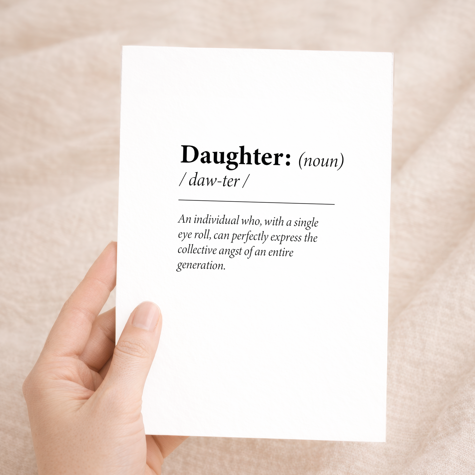 Fun dictionary-themed birthday card for a daughter featuring a humorous definition of the word Daughter on sustainable recycled cardstock, paired with a brown Kraft envelope.