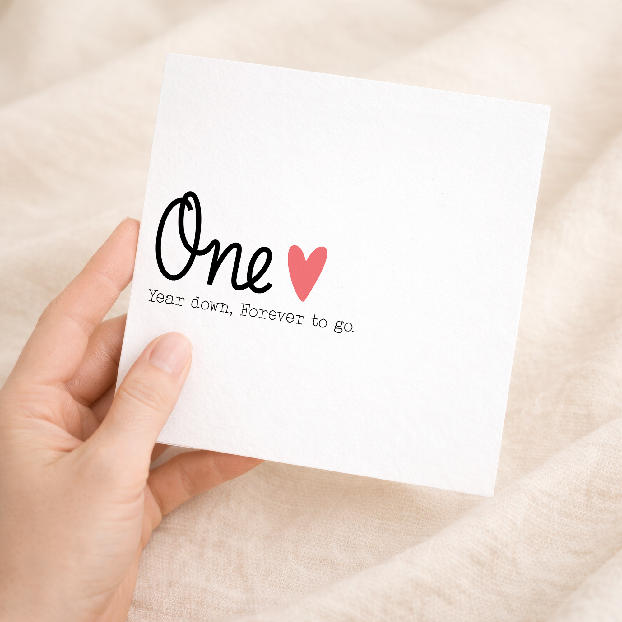 A simple and elegant 1st wedding anniversary greeting card for a wife or husband featuring a stylish letters and numbers design on a white background.