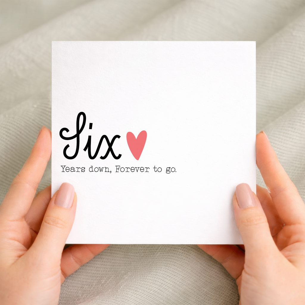 A simple and charming 6th wedding anniversary card featuring the number 6 in a decorative style on a white background.