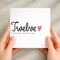 A simple 12th wedding anniversary greeting card for a husband or wife featuring a number 12 design on a white background.