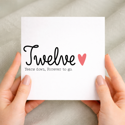 A simple 12th wedding anniversary greeting card for a husband or wife featuring a number 12 design on a white background.