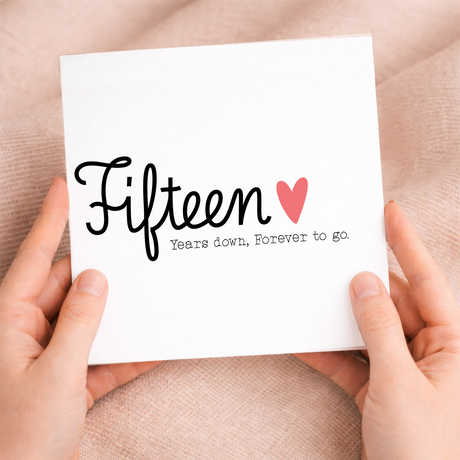 A romantic 15th Wedding Anniversary greeting card for a husband or wife featuring a stylish letters and numbers design on a white background.