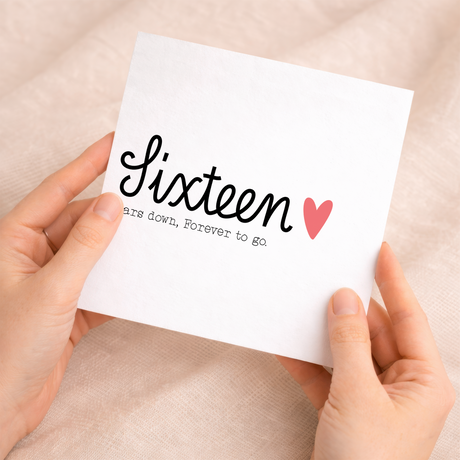 A romantic 16th wedding anniversary greeting card for a husband or wife featuring a simple letters and numbers design on a white background.