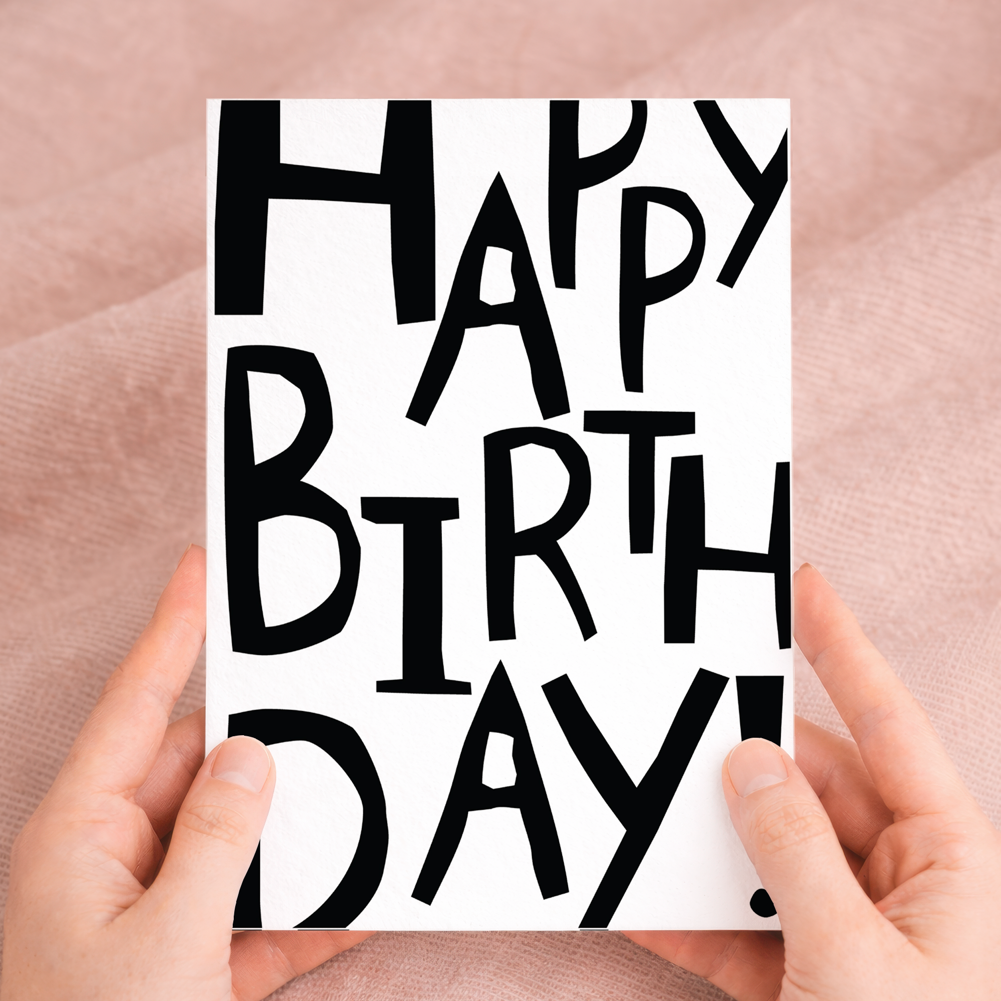 A 5x7 inch birthday greeting card featuring a decorative letters and numbers design on sustainable recycled cardstock, paired with a rustic brown Kraft envelope.